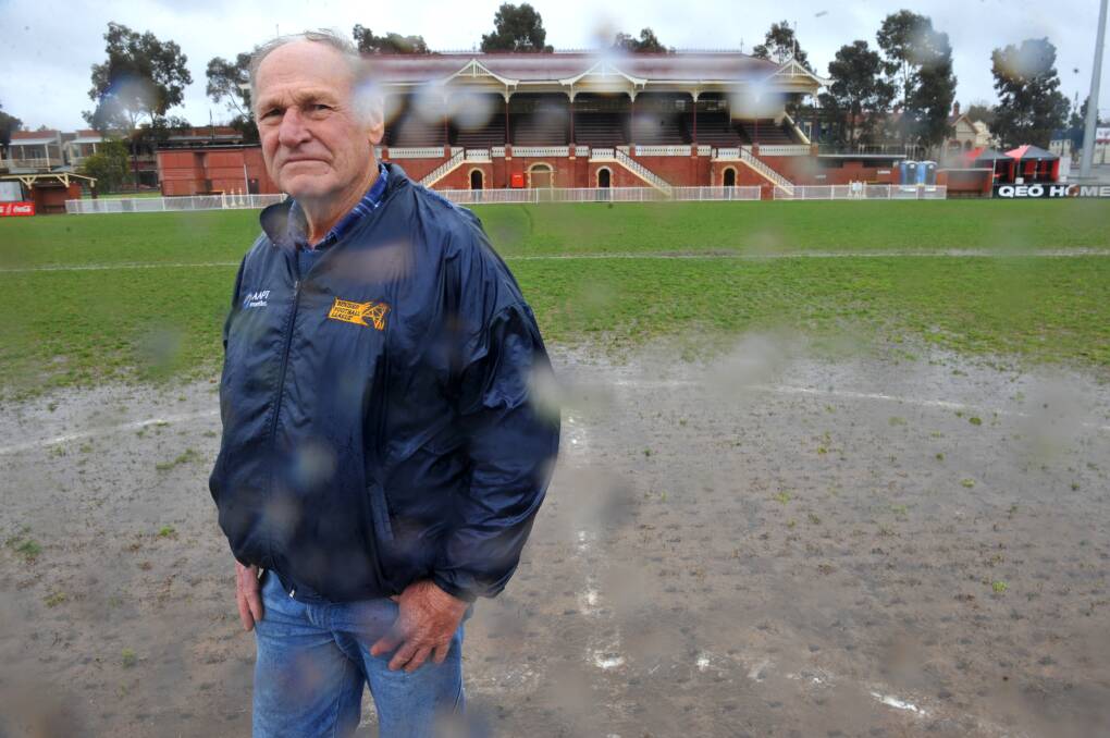TOUGH CONDITIONS: Ground manager Trevor Lee at the QEO after the second week of BFNL finals were postponed in 2010.