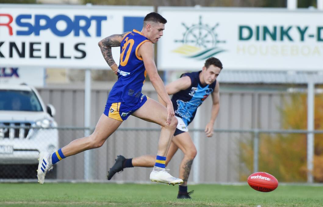 PACY: Golden Square's Alex Marklew takes a bounce during Saturday's 10-point victory over Eaglehawk at Wade Street. Marklew kicked two goals for the Bulldogs.