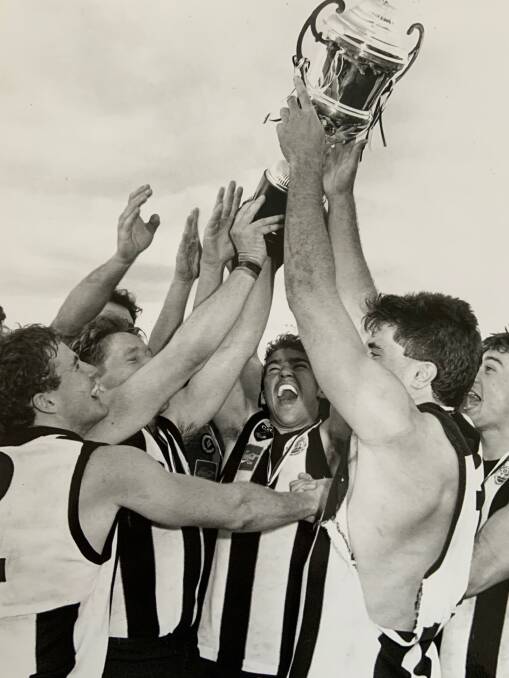 JUBILATION: Castlemaine players celebrate after beating Golden Square by five points in an epic 1992 grand final. It was the Magpies' first flag since 1952.