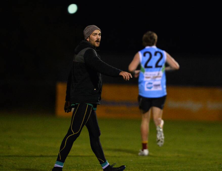 CALLING THE SHOTS: Kangaroo Flat coach James Flaherty oversees his group of 10 at Dower Park on Thursday night. Picture: LUKE WEST