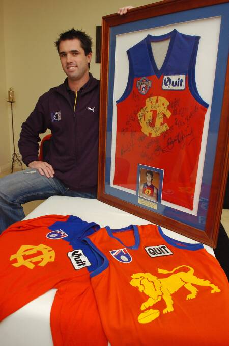 MEMORIES: Rowan Warfe, pictured in 2006, with some of his memorabilia from his days at Fitzroy, which drafted him at No.9 in 1993 from the Bendigo Pioneers.