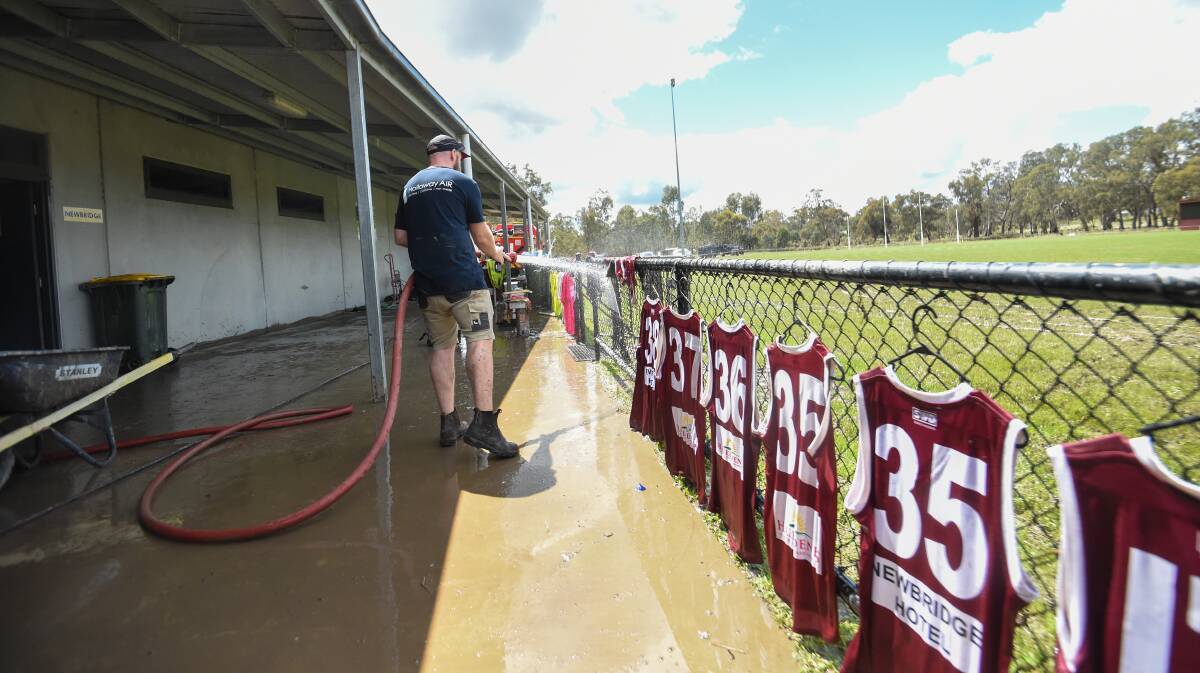 Newbridge's football jumpers are hosed down and hung out to dry on Sunday.