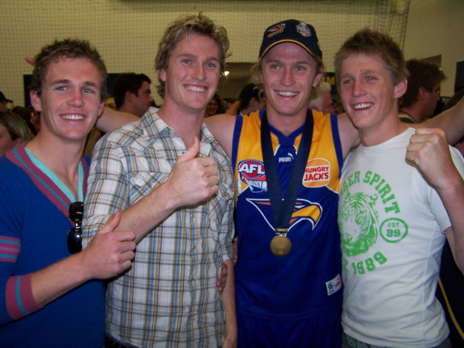 FOOTBALLING FAMILY: Joel, Troy, Adam and Scott Selwood after the Eagles' 2006 grand final win over Sydney. Between them the four brothers from Bendigo have played 738 AFL games.