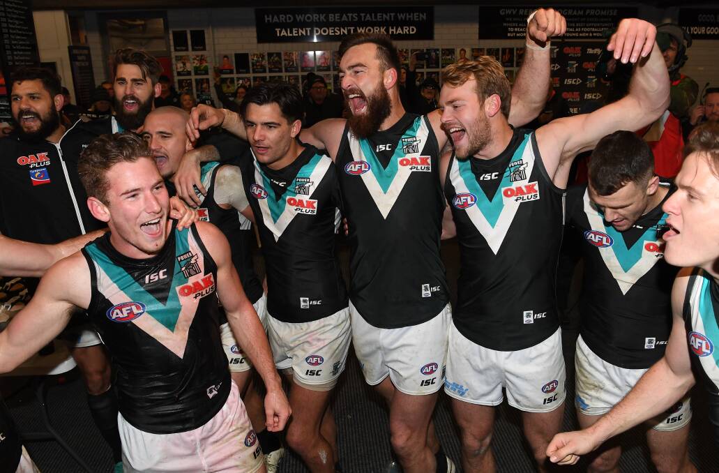 MEMORABLE MOMENT: Kane Farrell in the middle of the Port Adelaide team song after the Power's victory on Sunday. Picture: FAIRFAX MEDIA