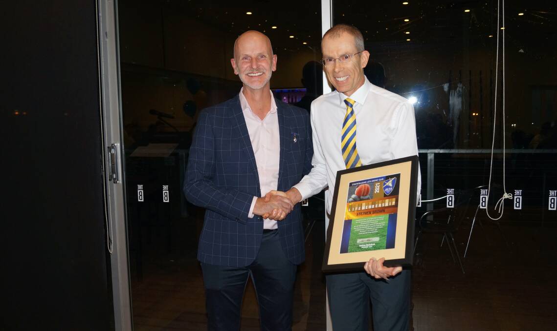 Stephen Brown (right) after receiving his Jets' life membership.