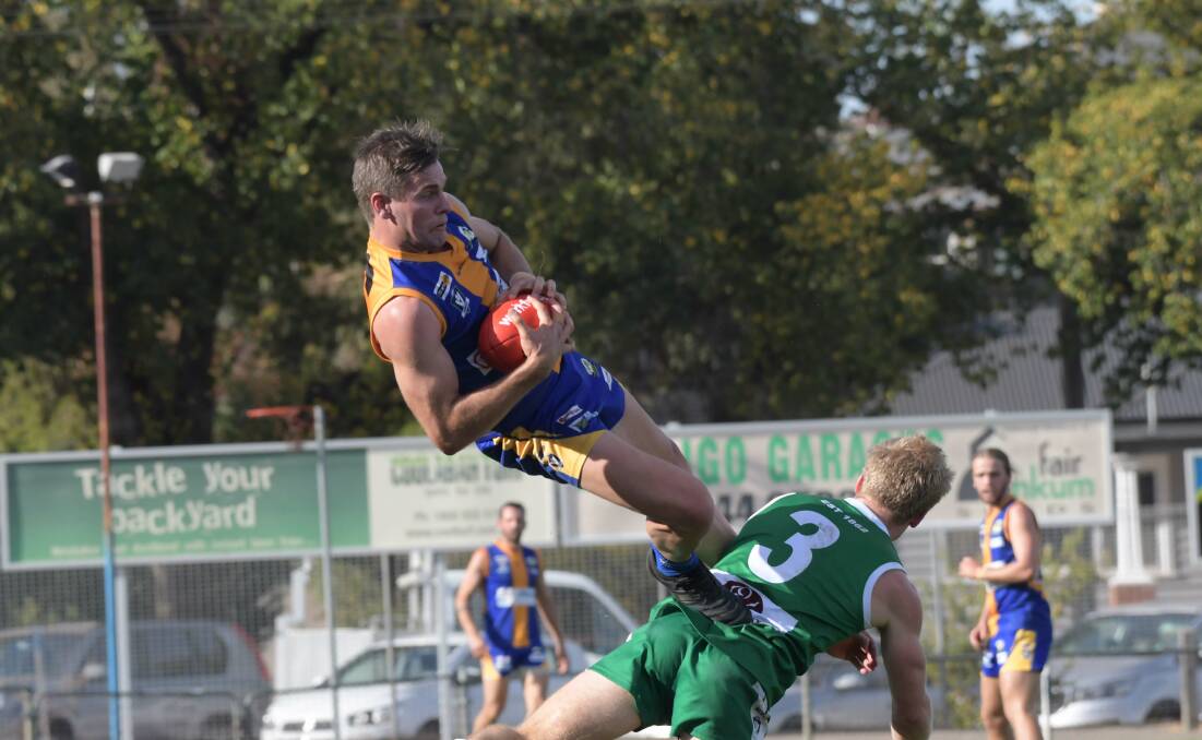 Golden Square's Hamish Morcom takes a ripper of a mark against Kangaroo Flat on Saturday. Picture: NONI HYETT