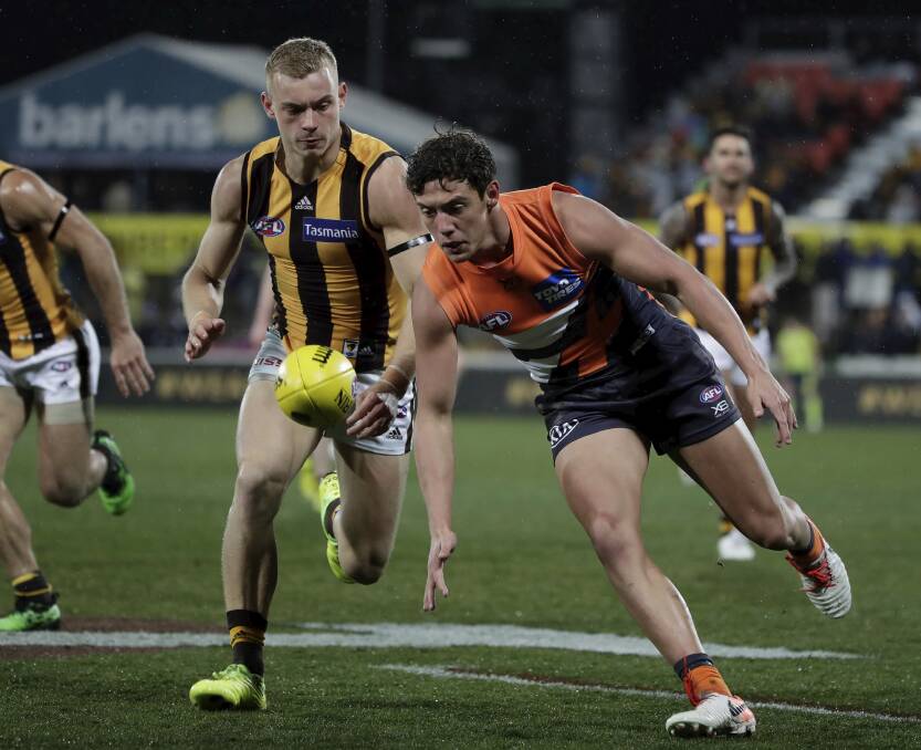 FRIDAY NIGHT FOOTY DEBUT: Jye Caldwell collected 13 possessions in his first AFL game for the GWS Giants against Hawthorn at Canberra's Manuka Oval. The Hawks won by 56 points in freezing conditions that included snow.