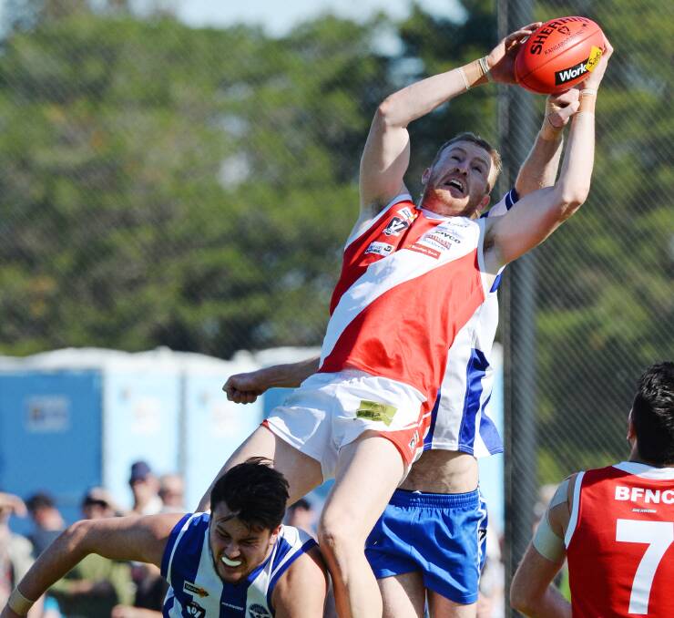 HIGH-FLYER: Bridgewater's Daniel Connors takes one of the marks of the day in the senior grand final against Mitiamo. Connors was one of the Mean Machine's stars, kicking three goals. Picture: DARREN HOWE