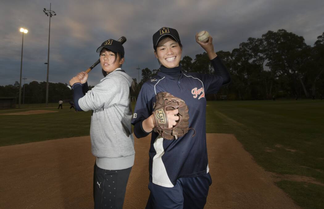 BATTER-UP: Japan All-Stars outfielder Ono Miku and pitcher Kishi Yuka at Thursday night's training session. Picture: NONI HYETT