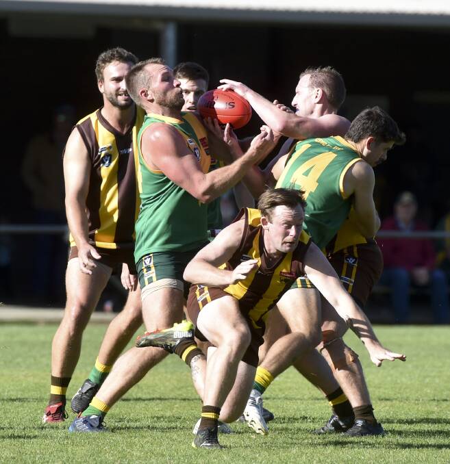DEFENSIVE GRIND: Colbinabbin staved off a challenge from Huntly to win by 26 points at Strauch Reserve in round seven of the HDFNL season on Saturday. More pictures at www.bendigoadvertiser.com.au. Picture: NONI HYETT