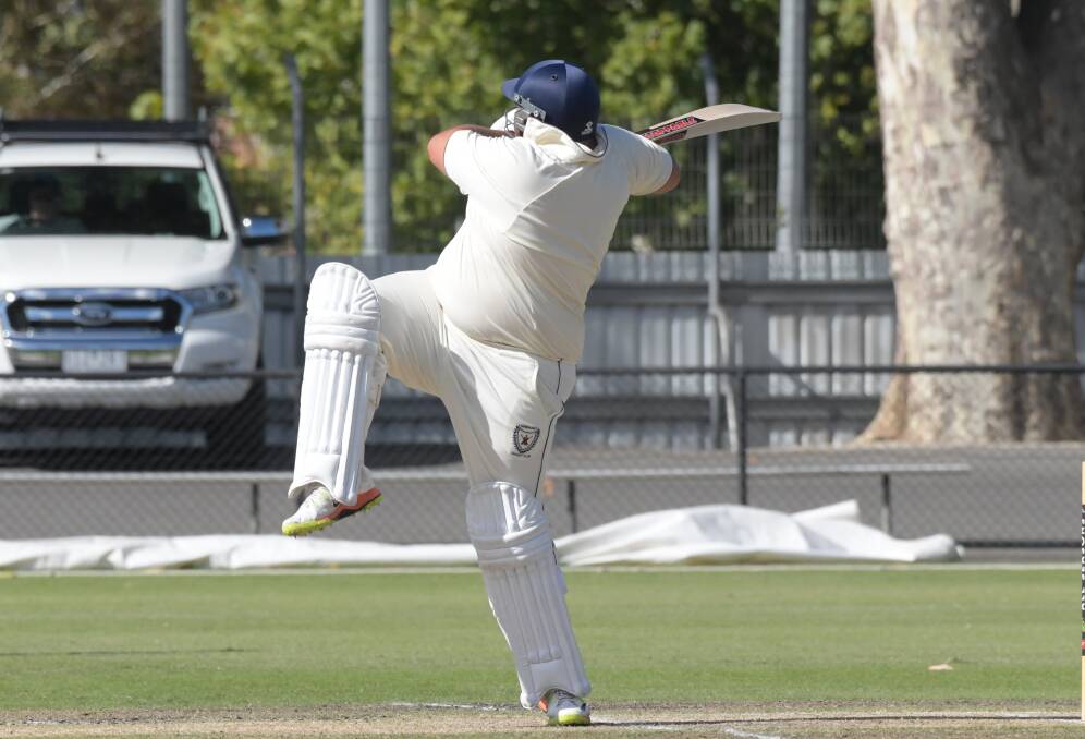 CRUNCH: Sandhurst's Ash Gray hits one of his five sixes in last season's grand final win over Strathdale-Maristians when he made 57 not out.