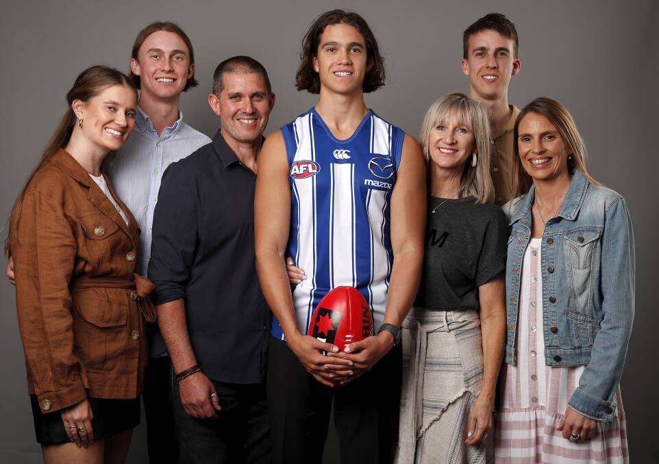 ALL SMILES: North Melbourne draftee Flynn Perez with his family after being selected by the Kangaroos with pick 35 on Thursday night. Picture: GETTY IMAGES