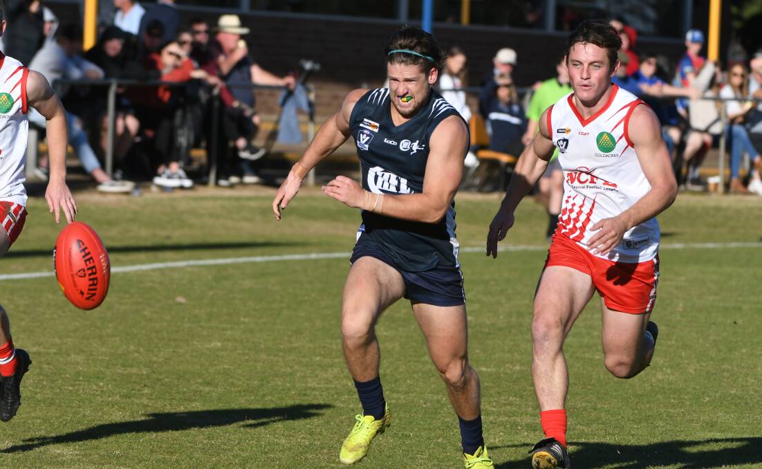 Lincoln Barnes (Central Highlands) and Trent Donnan (North Central) in pursuit of the ball on Saturday. Picture: KATE HEALY, BALLARAT COURIER