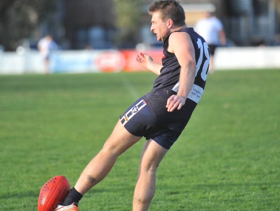 SINK THE BOOT IN: Mount Pleasant's Patrick O'Brien kicks the Blues inside 50 during the third quarter of Saturday's clash against North Bendigo.