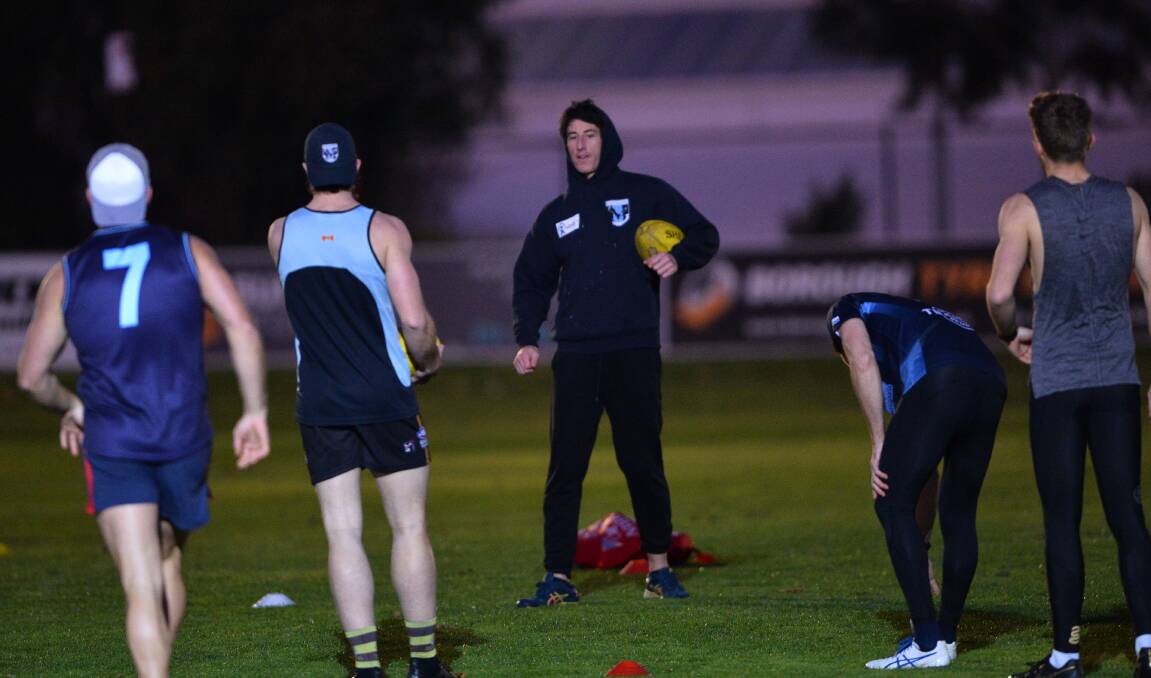 EXCITED TO BE BACK: Eaglehawk coach Travis Matheson explains the next non-contact drill at Canterbury Park on Thursday night. Picture: LUKE WEST