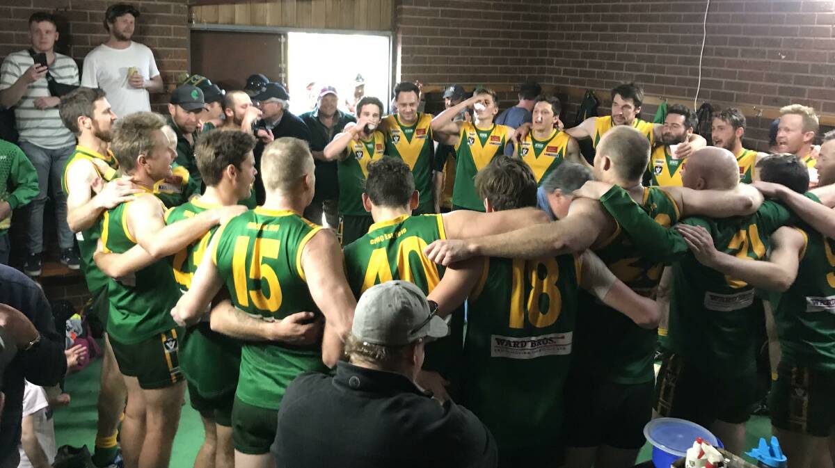 UP THERE COLBO: Colbinabbin players belt out their club song after Saturday's 29-point HDFNL qualifying final win over Lockington-Bamawm United at Gunbower. The Grasshoppers trailed by as many as 33 points during the second quarter. Picture: LUKE WEST