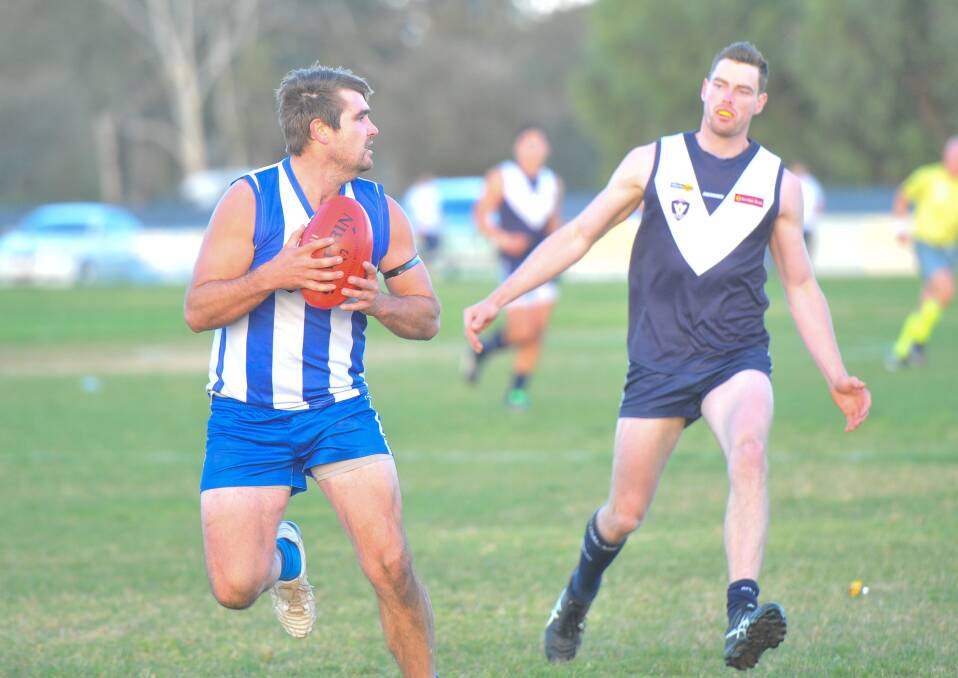 HARD-FOUGHT BATTLE: Mitiamo's Ben Bacon marks in front of Inglewood's Lachlan Sidebottom, who kicked four goals, during Saturday's match. Picture: ADAM BOURKE