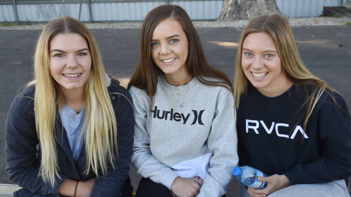 ENJOYING THE FOOTY: Maddi Hartley, Lauren Moloney and Taylor Fitton watched Wednesday's clash at the QEO.