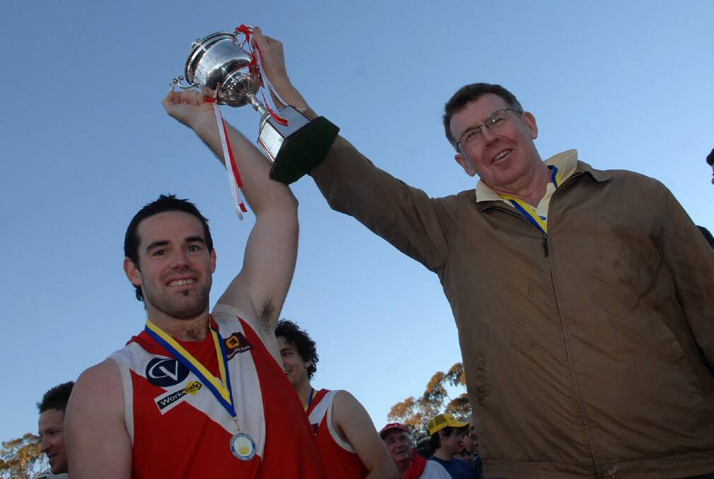 LEADERS: Elmore captain Andy Grant and coach Tony Southcombe hold aloft the HDFNL's premiership cup in 2007 to cap a 16-2 season by the Bloods.