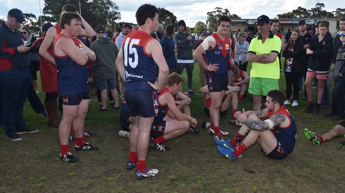 DISAPPOINTMENT: Wycheproof-Narraport players following last year's seven-point grand final loss to Charlton. Picture: NONI HYETT