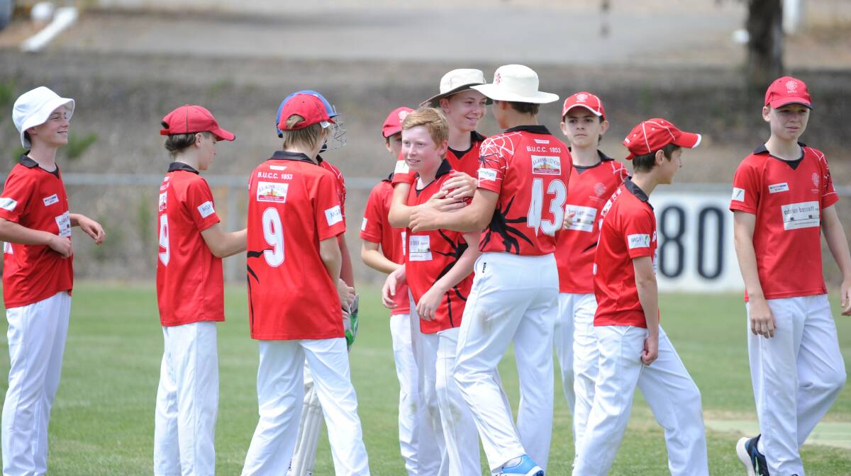 GOT HIM: Bendigo United under-14A players celebrate a wicket taken by Oscar Cail in Saturday's match against Strathfieldsaye. Cail took 2-5 in the Redbacks' 33-run victory at Ken Wust Oval. Pictures: ADAM BOURKE