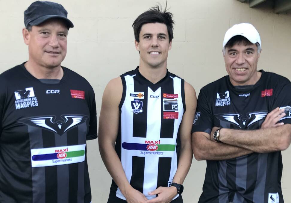 MARQUEE MAGPIE: Castlemaine recruit Angus Monfries with Magpies' co-coaches Shawn Filo and Derrick Filo at Camp Reserve last Friday night. Picture: LUKE WEST