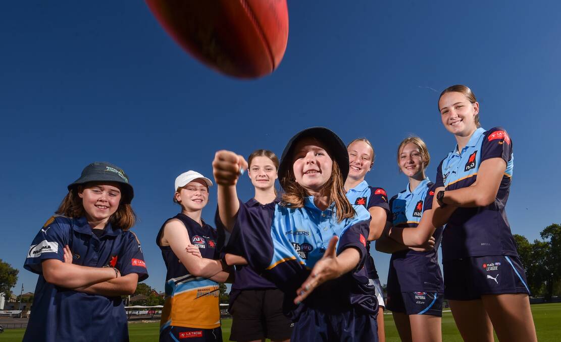 YOUNG TALENT: Aspiring Pioneers players Izzy Baker, Jordi O'Bree, Lacey Nihill and Colbie O'Bree with Pioneers' players Lucia Painter, Jazz Short and Freyja Pearce. Picture: DARREN HOWE