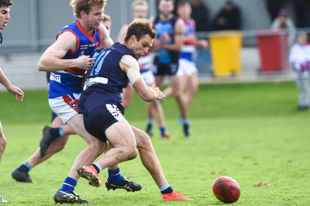 EYES ON THE PRIZE: Eaglehawk's Sam Thompson leads the chase for the ball against Gisborne on Saturday.