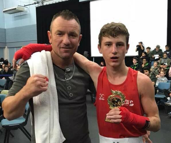 VICTORIOUS: Trainer Frank Pianto and Jake May. In his 12th career bout May won the 52kg Junior Open division at the New Zealand Golden Gloves Championships last weekend. Picture: CONTRIBUTED