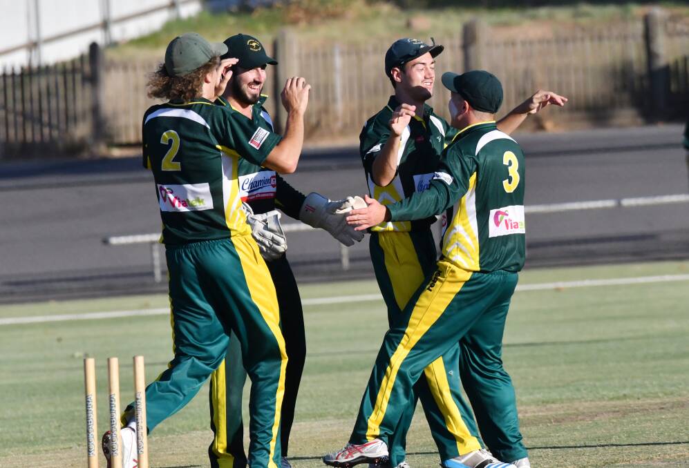 UP AND ABOUT: Kangaroo Flat players celebrate after Chris Barber ran out Strathdale-Maristians' Cameron Taylor with a direct hit in the T20 grand final. Picture: DARREN HOWE