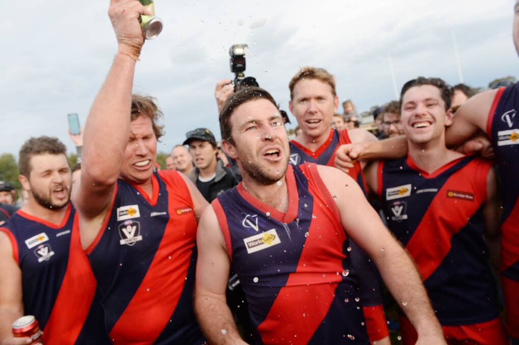 CELEBRATIONS: Calivil United players bask in the glory of their 2017 premiership success, which ended Bridgewater's run of seven flags in a row.