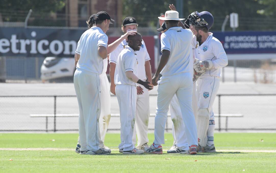 Huntly-North Epsom celebrates one of Sandun Ranathunga's two wickets on Saturday. Picture: NONI HYETT