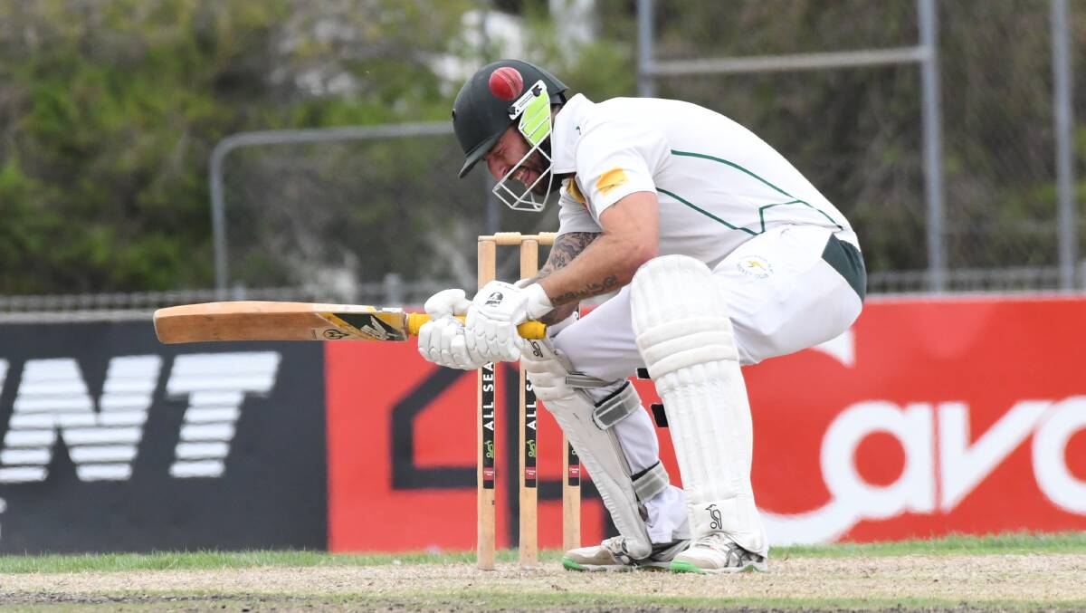 NASTY KNOCK: Kangaroo Flat's Josh Collinson is struck by a bouncer from Strathdale's Chris Sole on Sunday. Collinson retired hurt on 0, but returned to make 49.