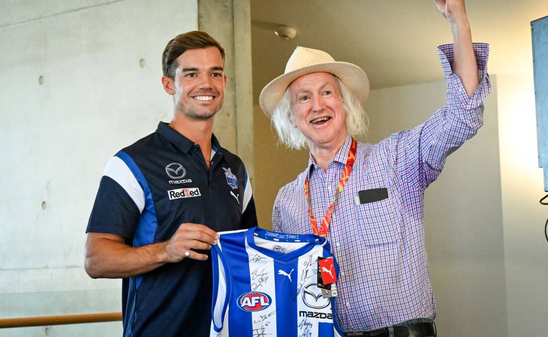 North Melbourne co-captain Jy Simpkin with City of Greater Bendigo councillor and Kangaroos' supporter Rod Fyffe at Monday's civic reception. Picture by Darren Howe
