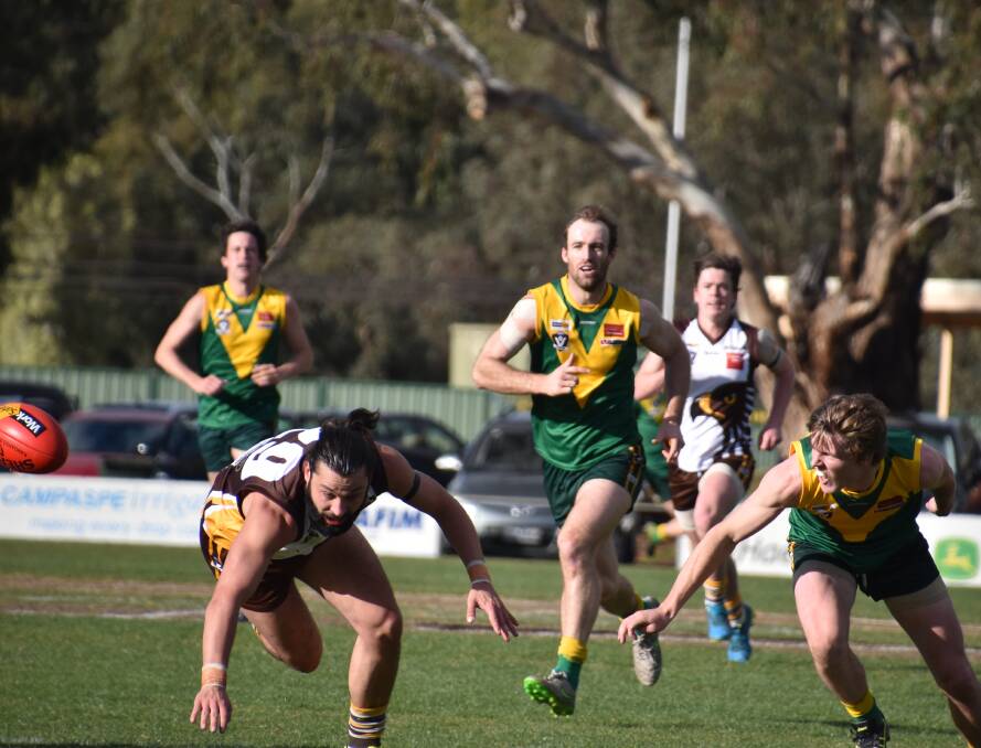 DESPERATE: Huntly's Tom Paterson and Colbinabbin's Will Morrow, who was one of his side's best, hunt the ball in Saturday's clash at M.J. Morgan Oval. Picture: SADIE VALE