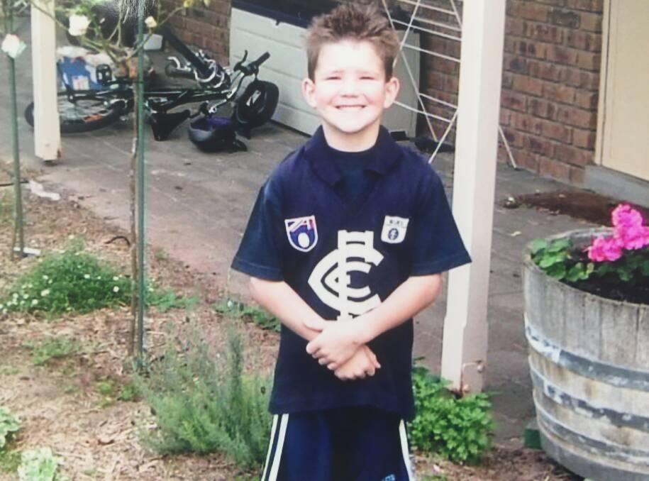 BLUES BARRACKER: Angus Schumacher wearing a Carlton jumper as a seven-year-old.