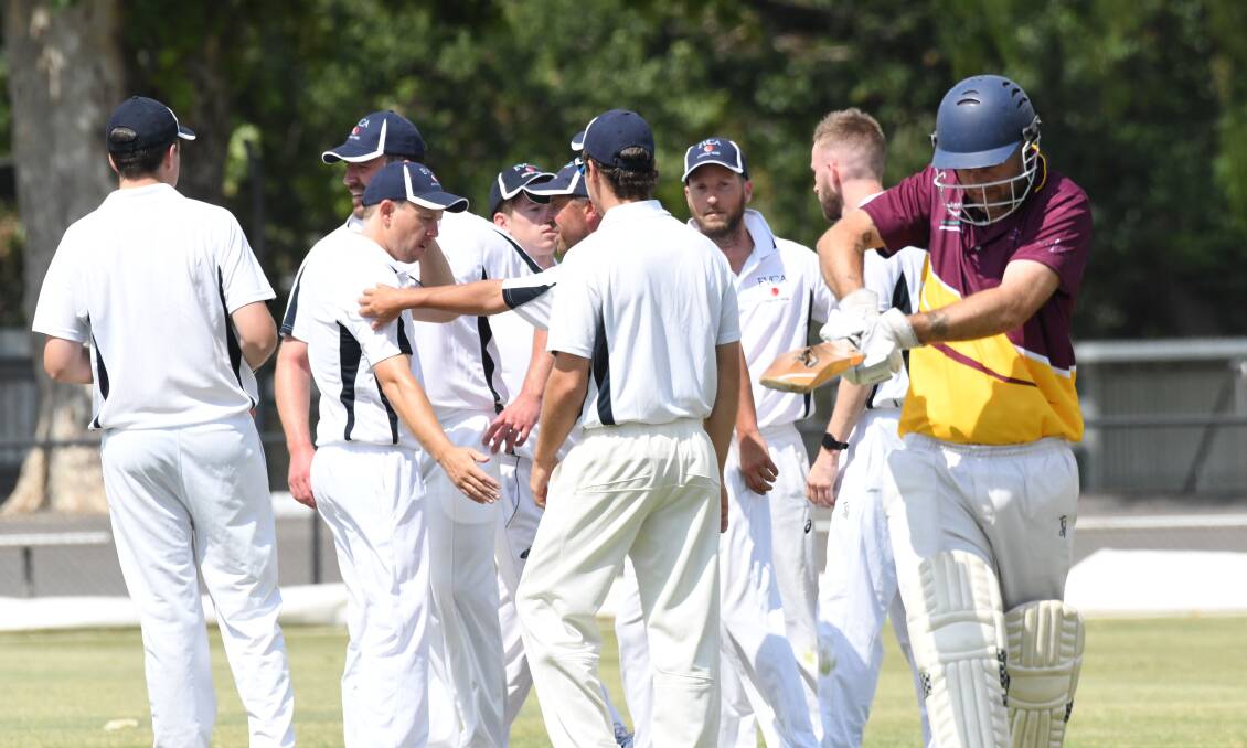 FIRST WIN ON THE BOARD: Emu Valley players celebrate a wicket in their Bendigo Country Week victory over Grassmere at the QEO on Sunday. Emu Valley won by five wickets with more than half its overs still left up its sleeve. Picture: NONI HYETT