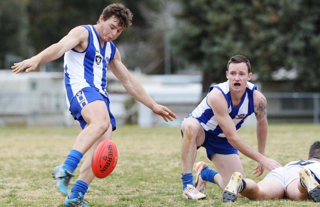 SINKING THE BOOT IN: Mitiamo youngster Thomas Eade gets a kick away in the Superoos' 70-point win over YCW in round 18 that secured their finals berth.