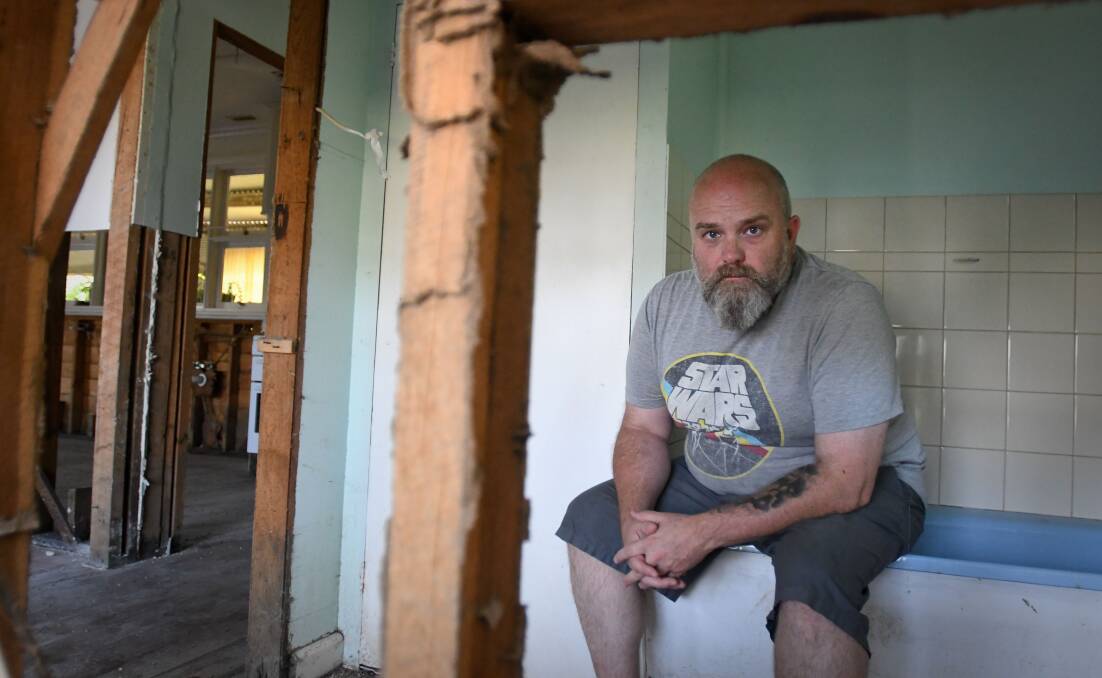 Leigh Wilson at his family home in Rochester, where his mother will be living in a caravan until her house is repaired from flood damage. Picture by Noni Hyett