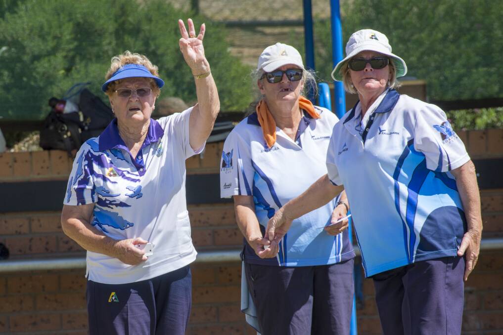 THREE TO US: Inglewood's Shirley Sloan signals three shots for her rink during Monday's 12-shot loss to Eaglehawk in round 10 of BBD midweek pennant. Also pictured are Eaglehawk's Jenny O'Shea and Deb Spencer. Pictures: DARREN HOWE