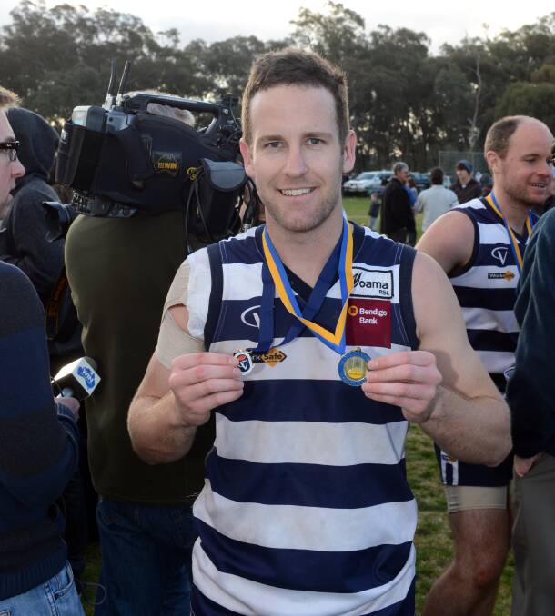 BIG DAY: Nathan O'Brien with his 2012 premiership medal and grand final best-on-ground medal.