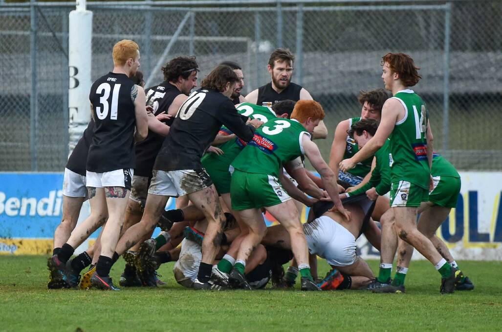 TEMPERS FLARE: Castlemaine and Kangaroo Flat players get heated with each other during the earlier meeting in the BFNL this season. Picture: PETER WEAVING