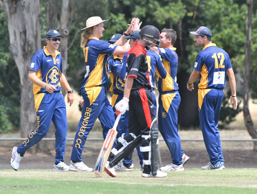 UP AND ABOUT: Bendigo players celebrate a wicket in their win over White Hills at Scott Street on Saturday. Picture: NONI HYETT