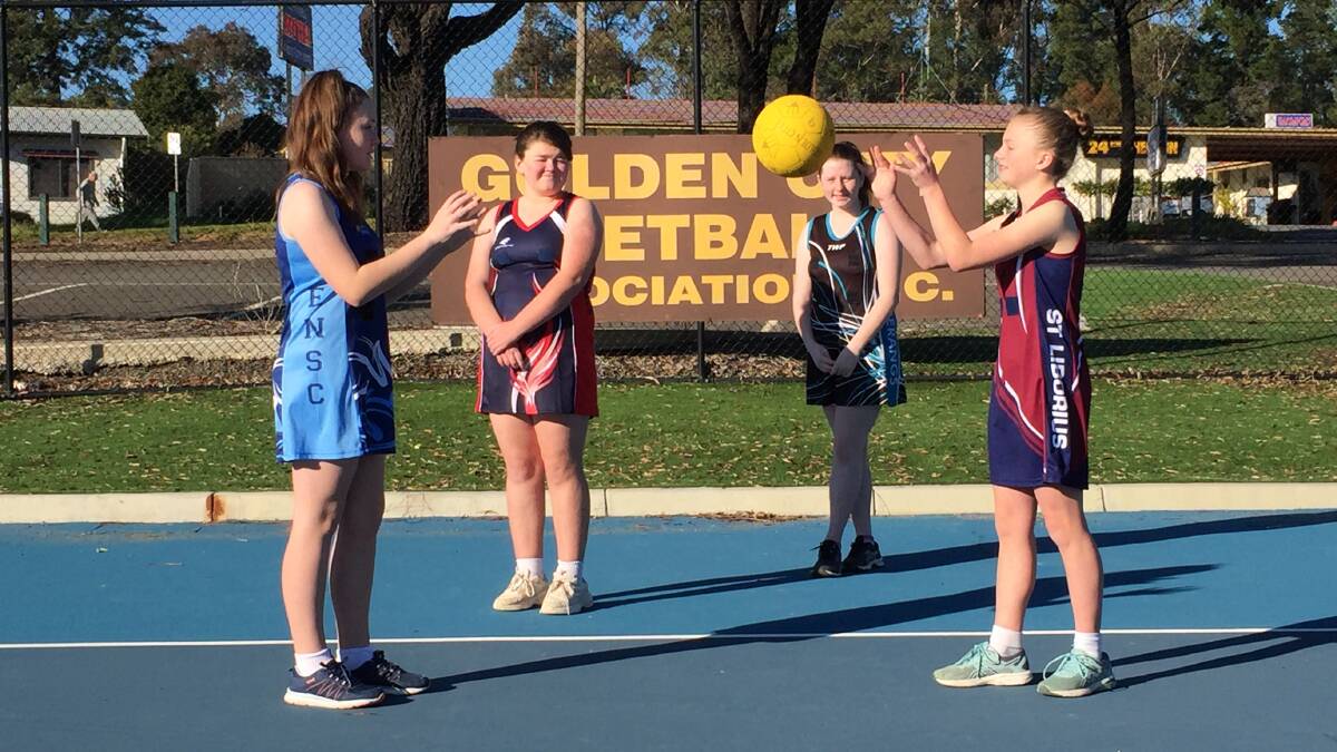 RETURN LOOMING: Golden City Netball Asscoation players Heidi Grant and Mia Dewhurst (back) with Jayde Henderson and Breana Barker (front). The association will be back on court competing again next month at West Bendigo. Picture: LUKE WEST.