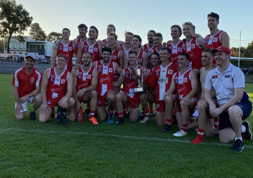 South Bendigo players with the Graeme Wright Memorial Cup. Picture: LUKE WEST