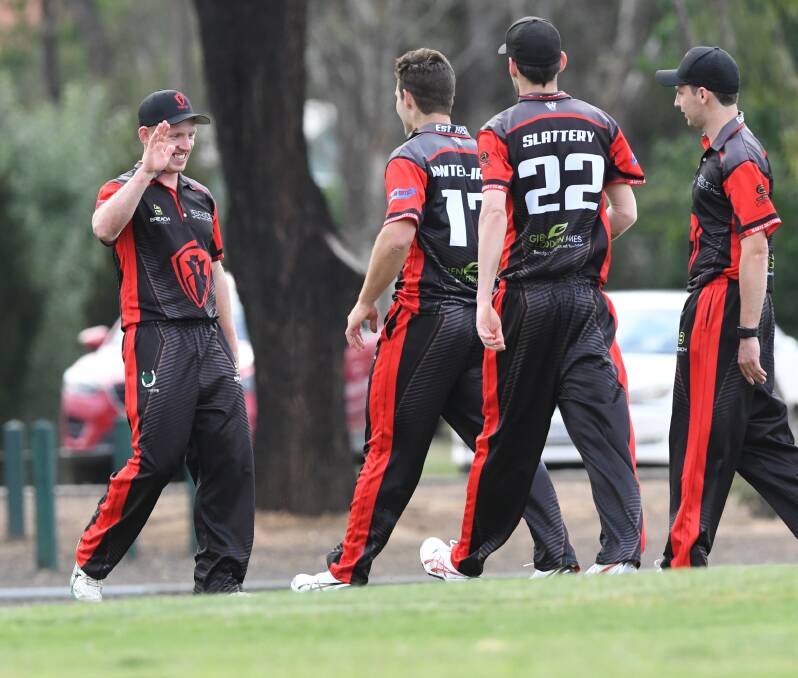 HIGH FIVE: White Hills' Gavin Bowles is all smiles after his catch of Mitch Kemp off Mitch Winter-Irving during the Demons' three-wicket win over Golden Square on Tuesday night. Picture: NONI HYETT
