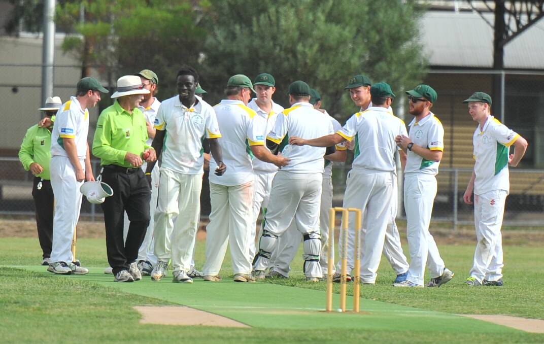 GOT HIM: Spring Gully players celebrate a Saheed Akolade wicket against United on Saturday. Picture: LUKE WEST
