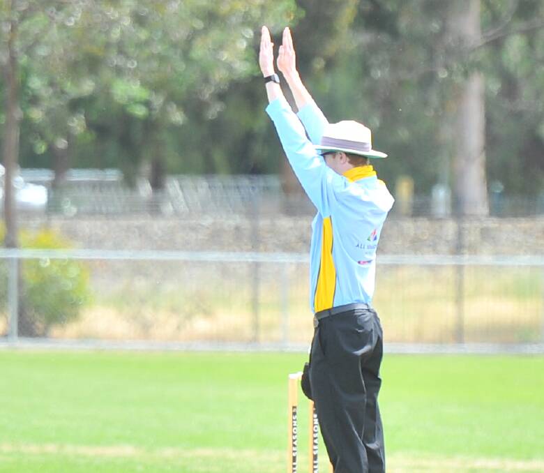 OFFICIATING: Dean Conway is one of the Bendigo District Cricket Umpires Association's younger members. Conway signals a six at Weeroona Oval lat Saturday.