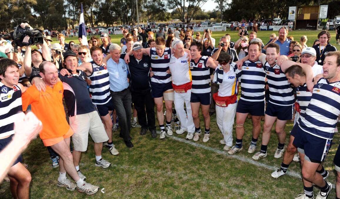 CELEBRATIONS: LBU players belt out the Cats' club song following their six-point victory over Heathcote in the 2011 HDFL grand final.