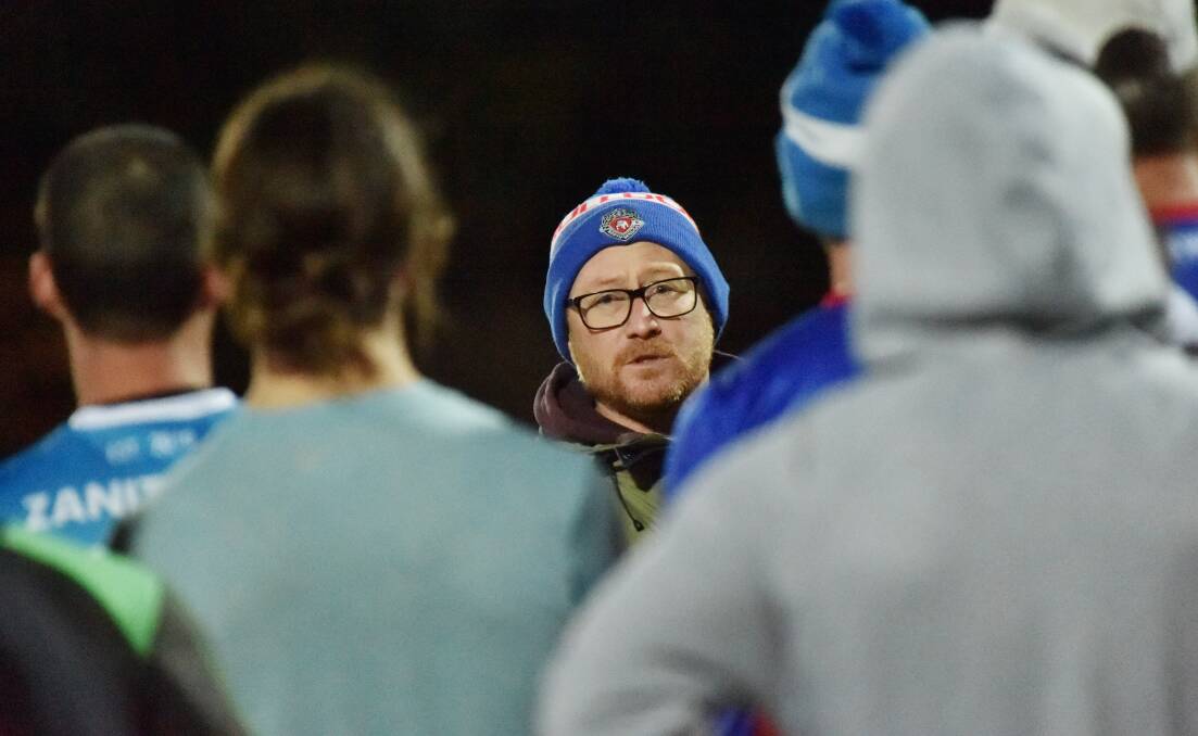 ON THE TRACK: North Bendigo coach Matt Dillon speaks with his players at training on Tuesday night ahead of a huge clash against LBU. Picture: DARREN HOWE